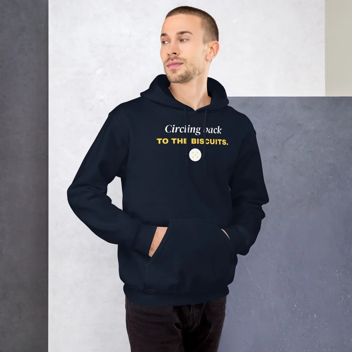 Circling back to the biscuits — navy unisex hoodie: On model, front