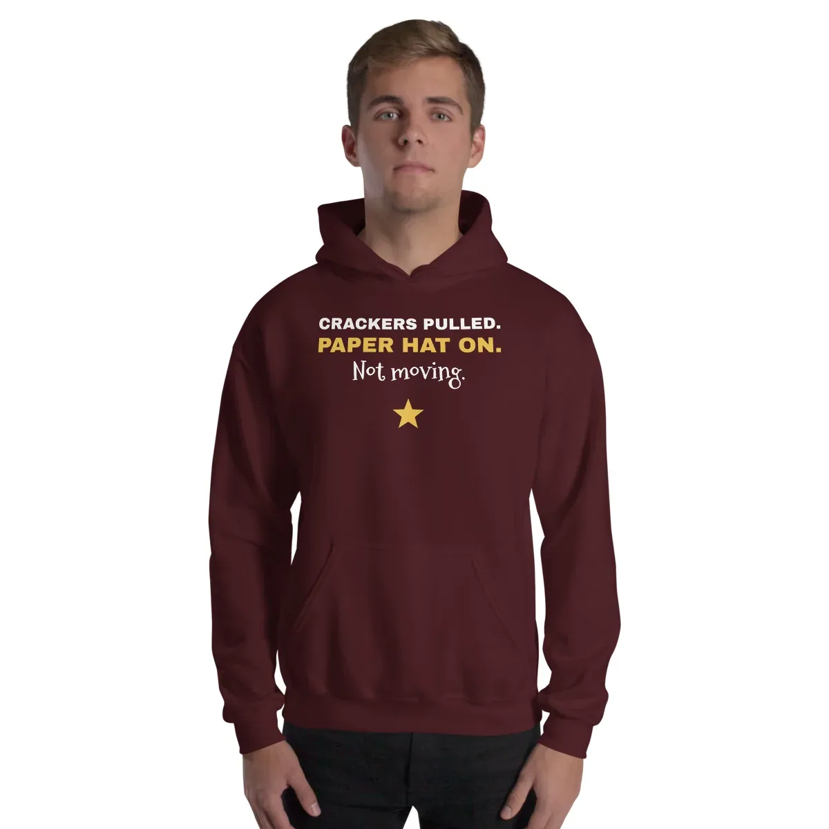 Crackers pulled. Paper hat on. Not moving. — maroon unisex hoodie: On model, front