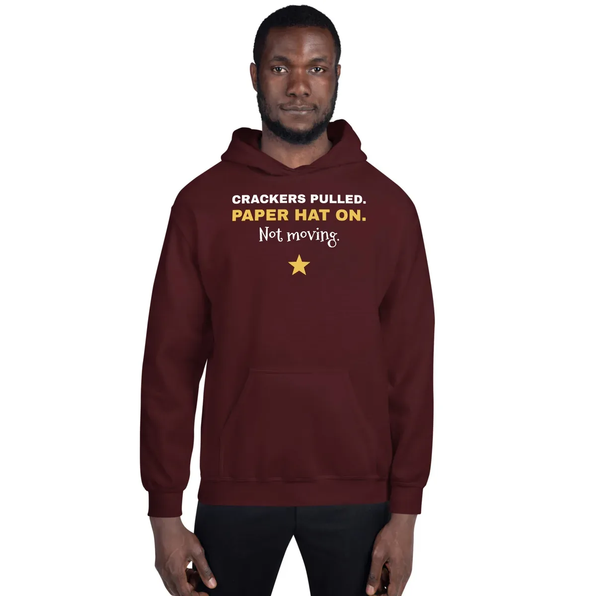 Crackers pulled. Paper hat on. Not moving. — maroon unisex hoodie: On model, front