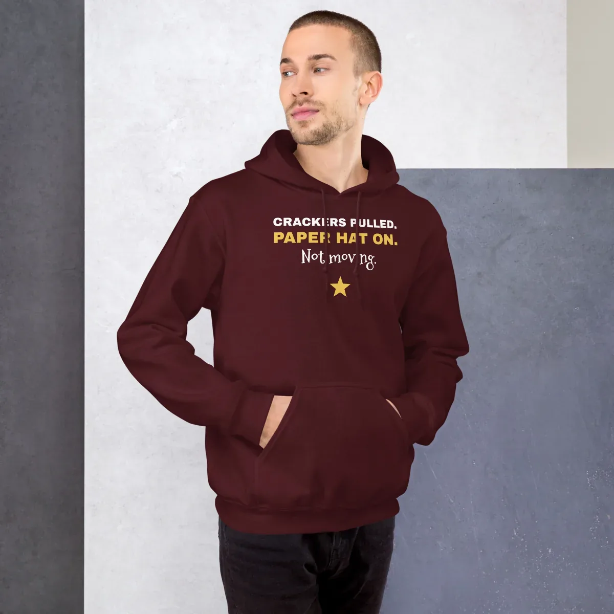 Crackers pulled. Paper hat on. Not moving. — maroon unisex hoodie: On model, front