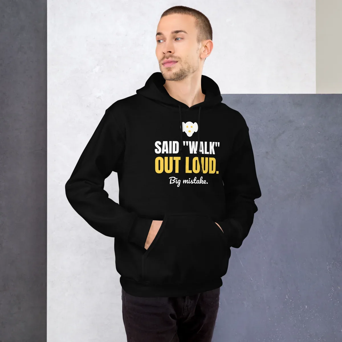 Said "walk" out loud. Big mistake. — black unisex hoodie: On model, front