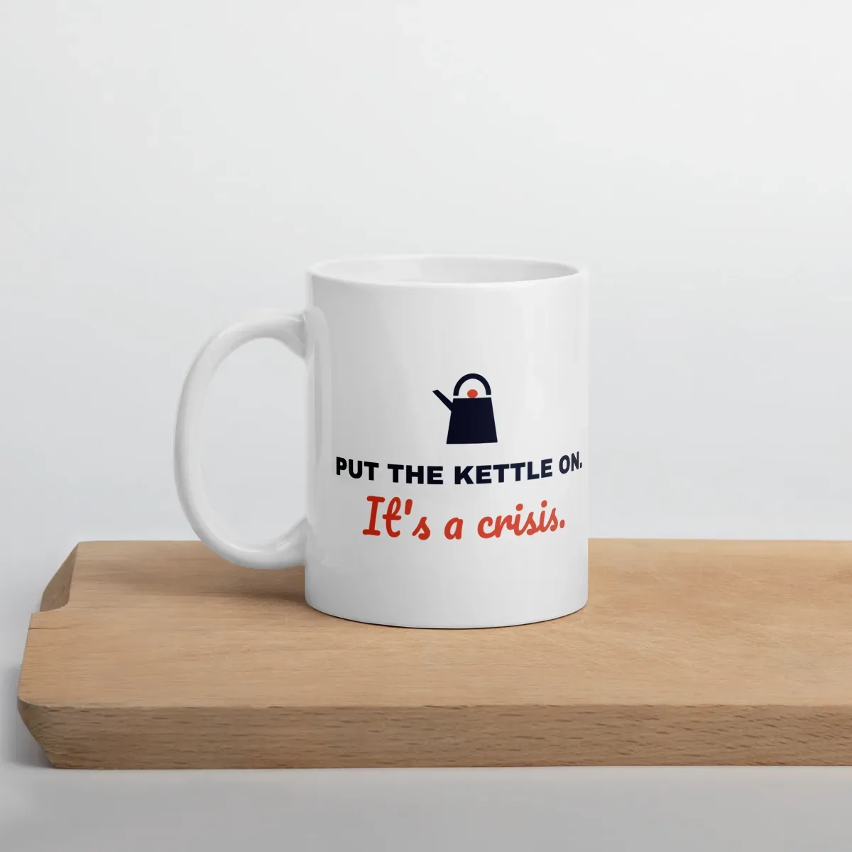 Put the kettle on. It's a crisis. — 11oz mug: Lifestyle, cutting board