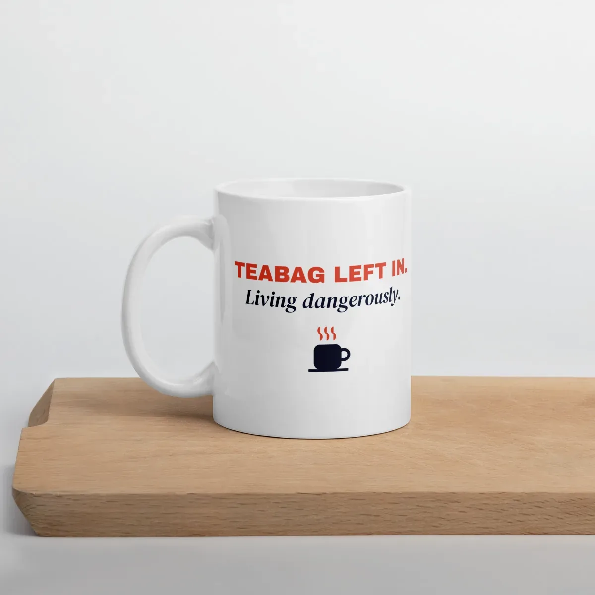 Teabag left in. Living dangerously. — 11oz mug: Lifestyle, cutting board