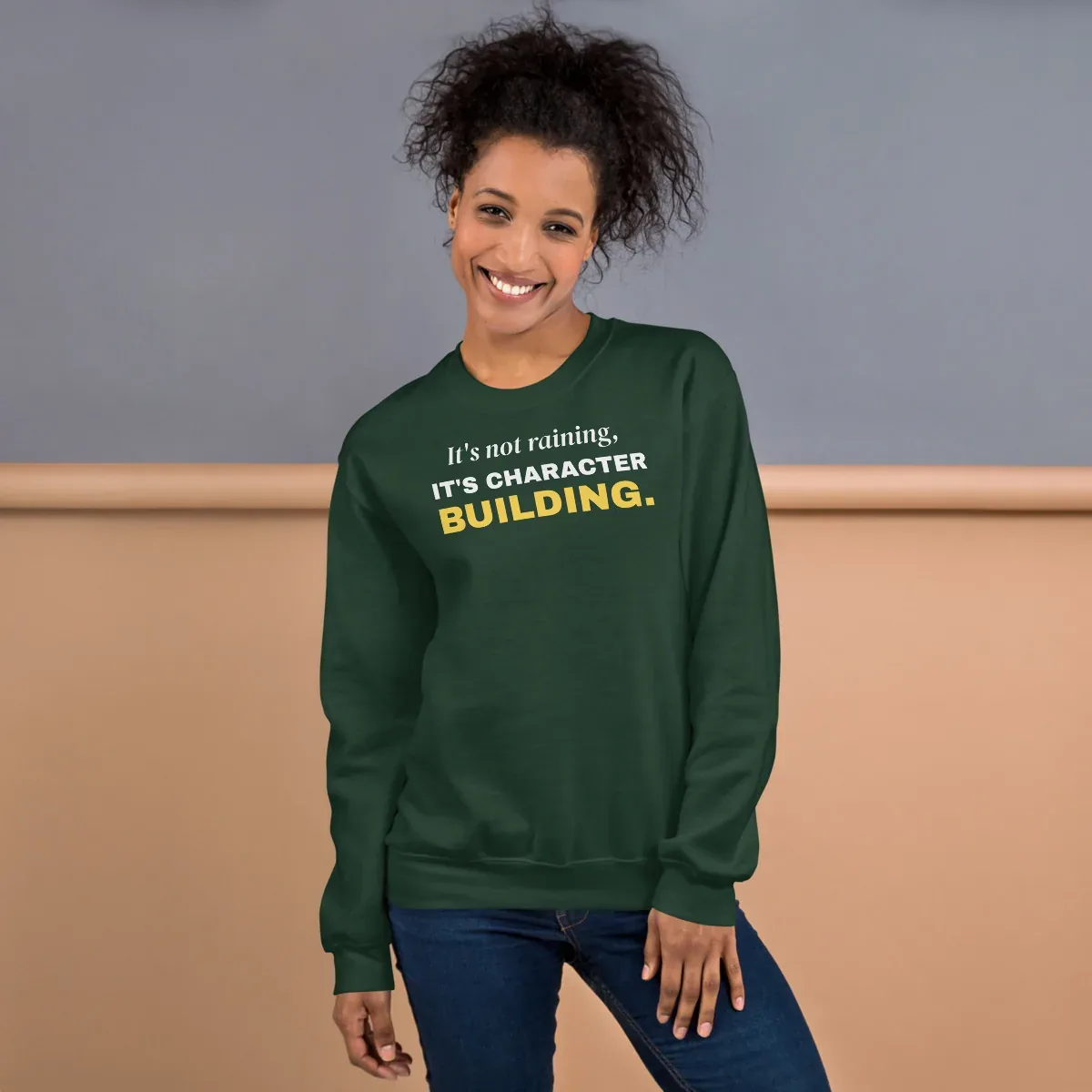 It's not raining, it's character building — forest green unisex sweatshirt: On model, front
