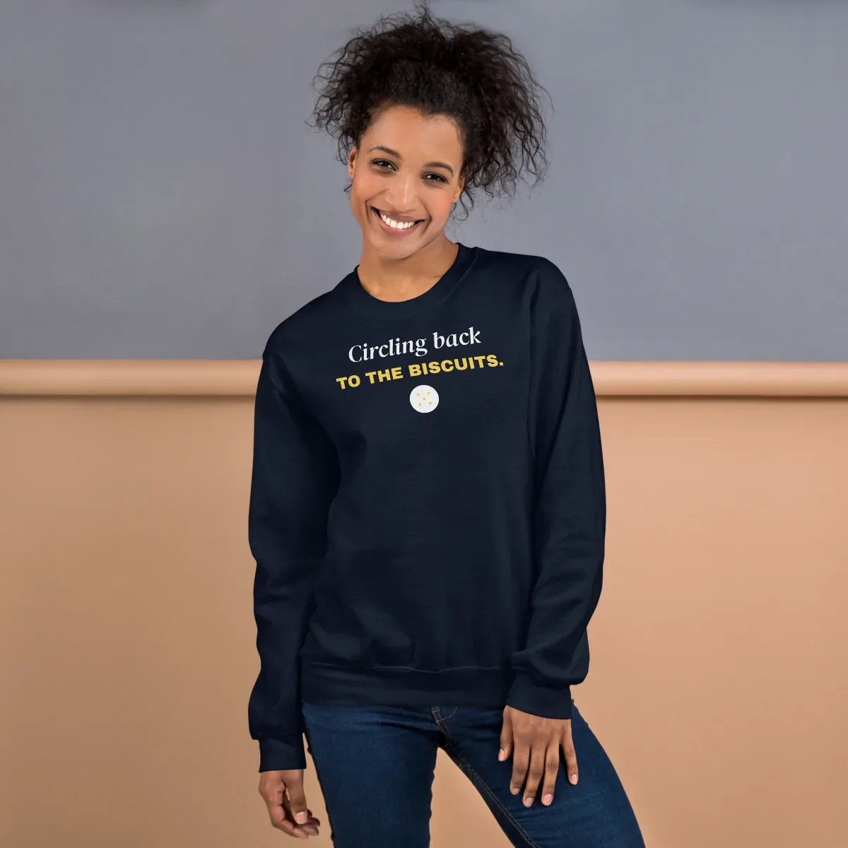 Circling back to the biscuits — navy unisex sweatshirt: On model, front