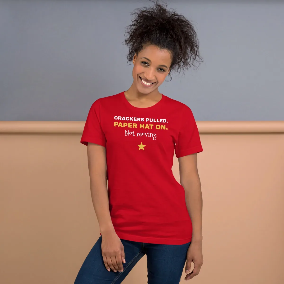 Crackers pulled. Paper hat on. Not moving. — red unisex tee: On model, front