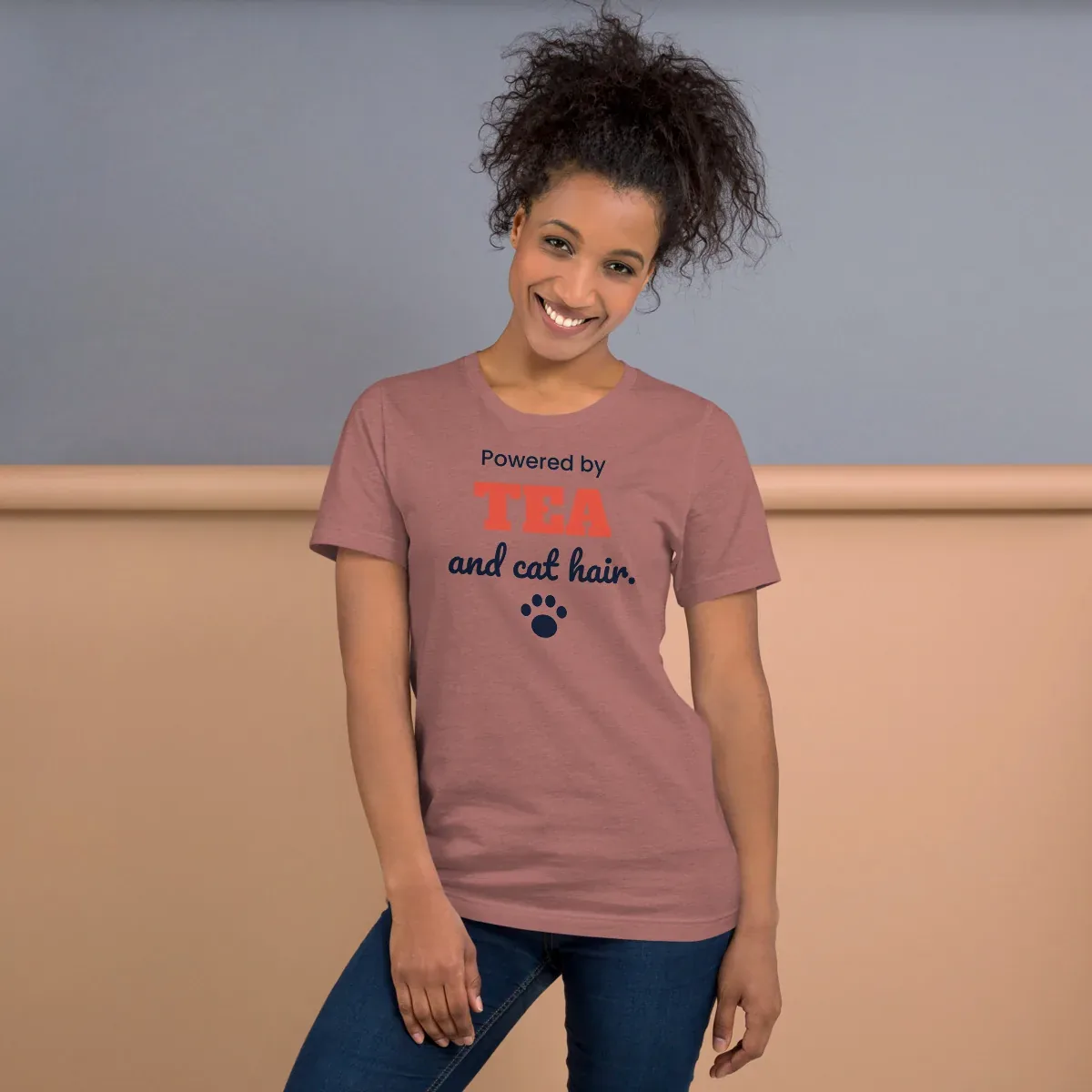 Powered by tea and cat hair — heather mauve unisex tee: Worn (lifestyle)