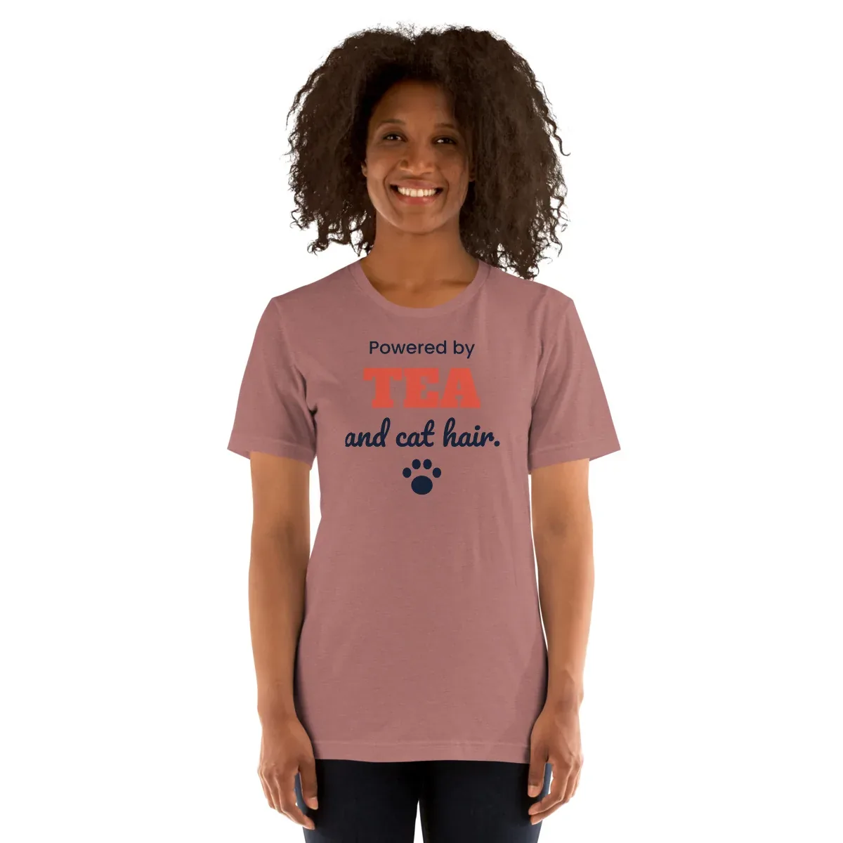 Powered by tea and cat hair — heather mauve unisex tee: Worn (model)
