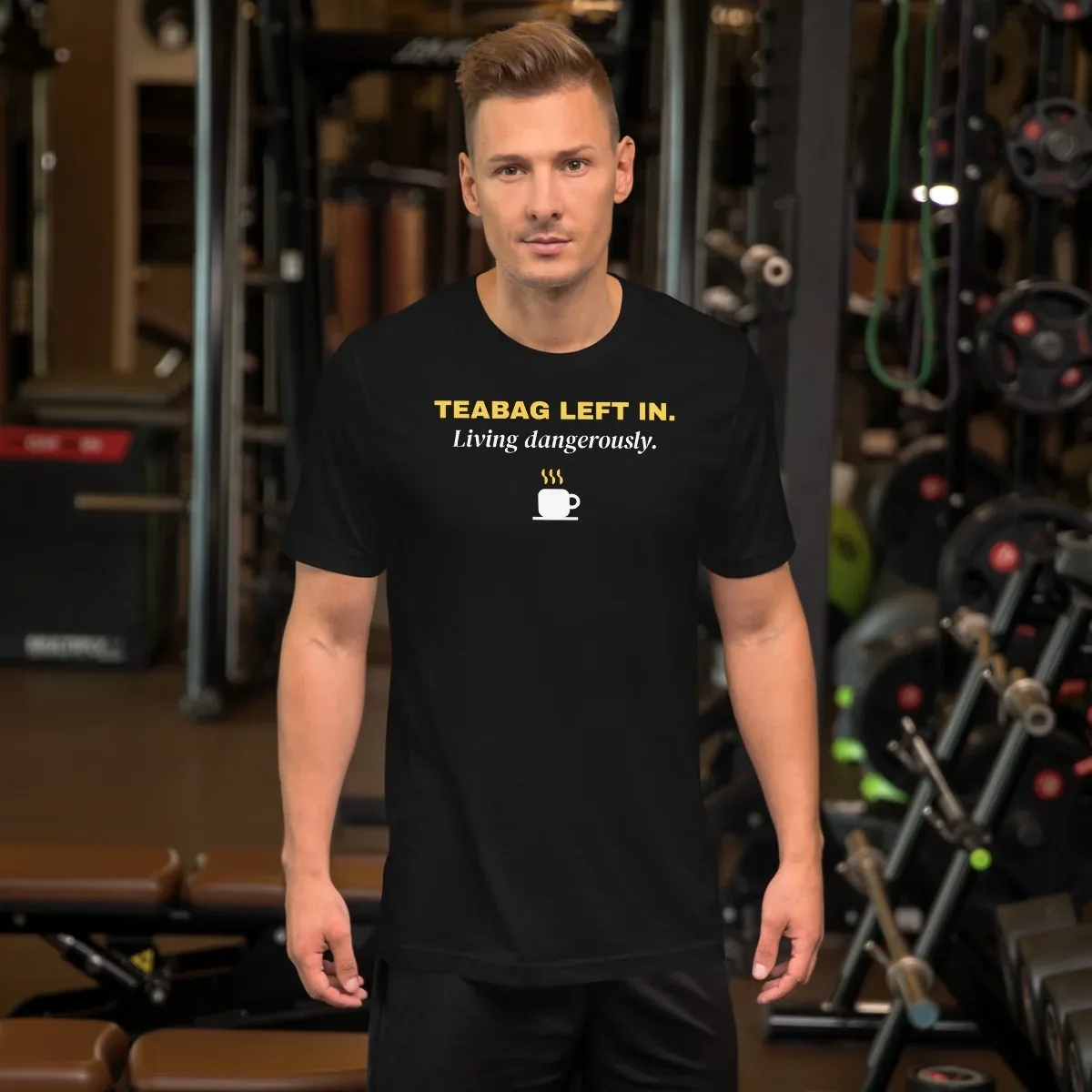 Teabag left in. Living dangerously. — black unisex tee: On model, front