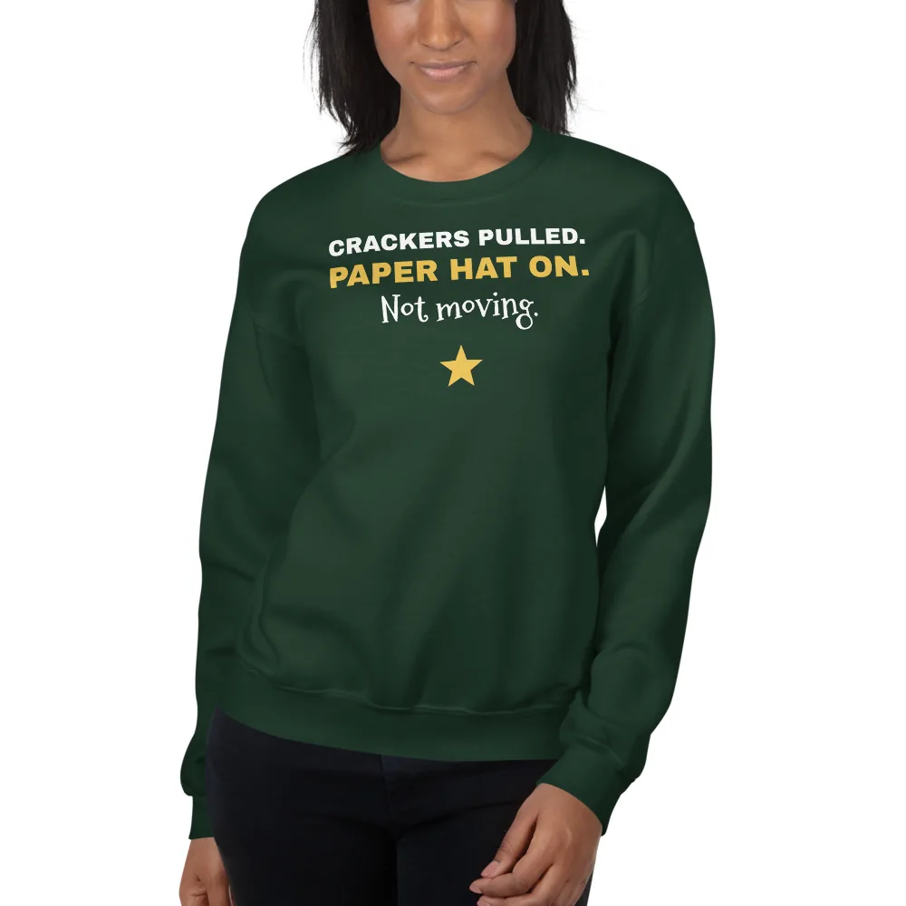 Crackers pulled. Paper hat on. Not moving. — forest green unisex sweatshirt: On model, another person