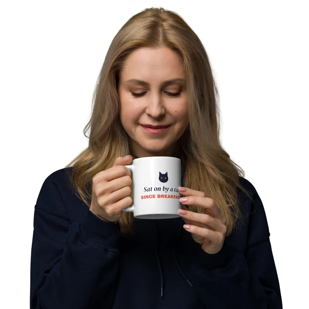 Sat on by a cat since breakfast — 11oz mug: In hand